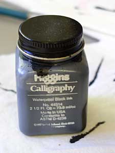 A bottle of black ink.